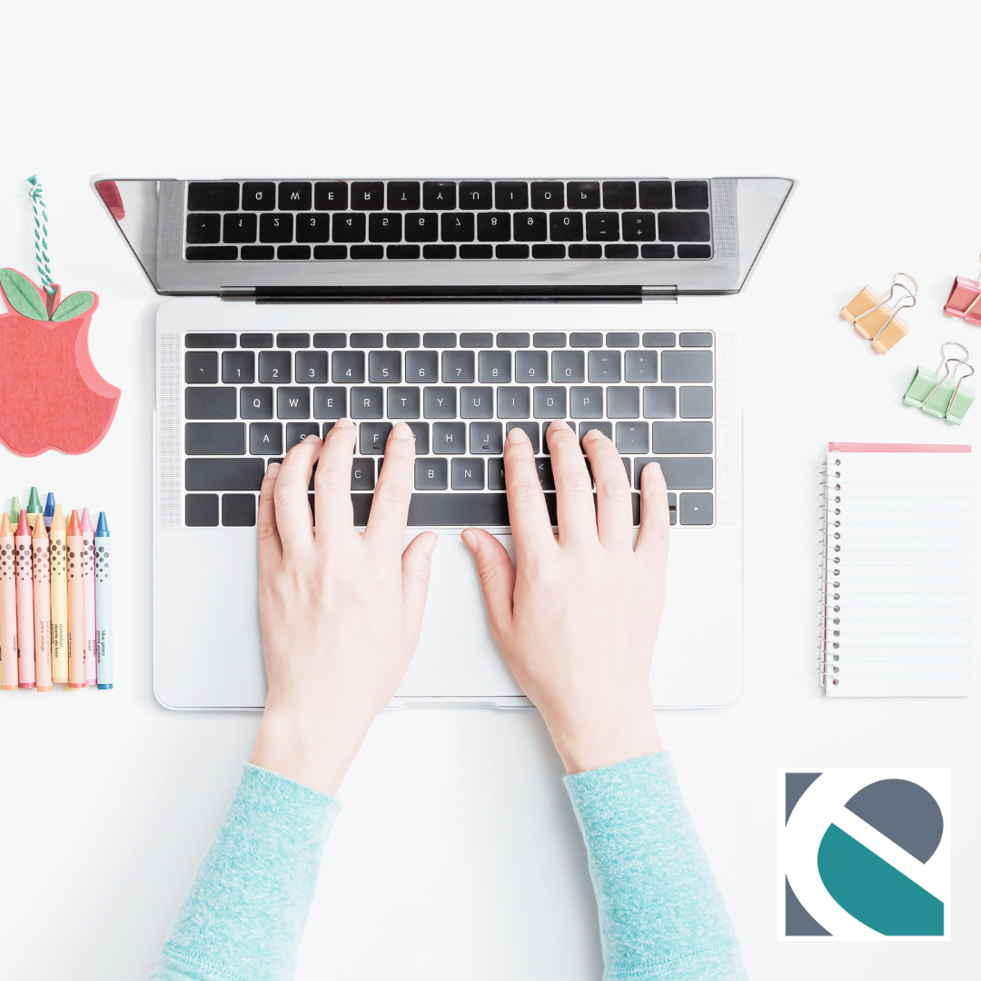 Hands typing on a laptop surrounded by colorful school supplies, including crayons, an apple-shaped notepad, and a notebook. eCreekIT logo in bottom right hand corner